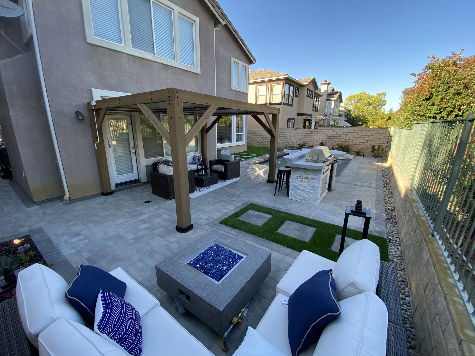 Completed backyard with pergola and fire table