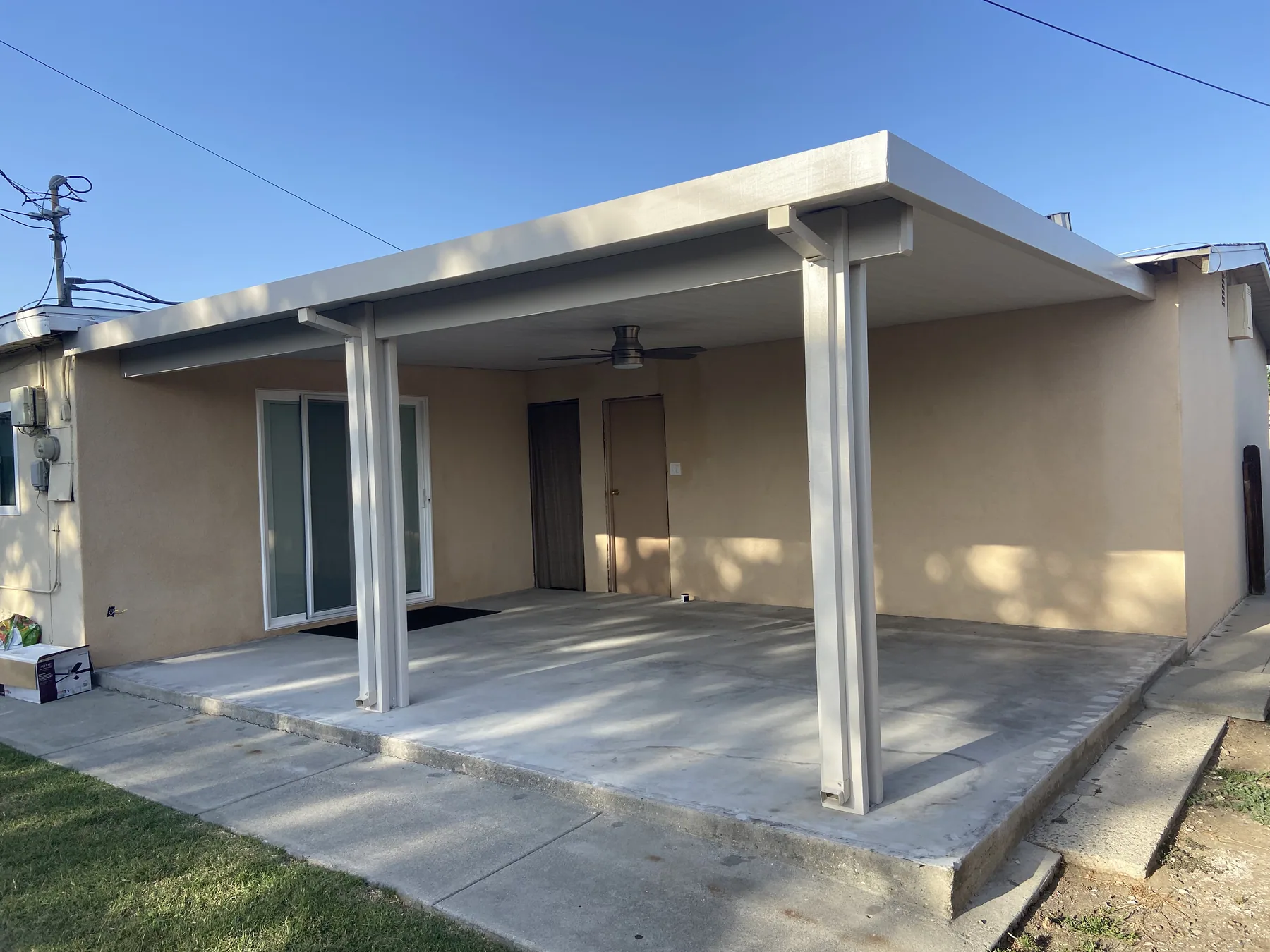 Shaded outdoor lounge area built by NexGen Remodeling