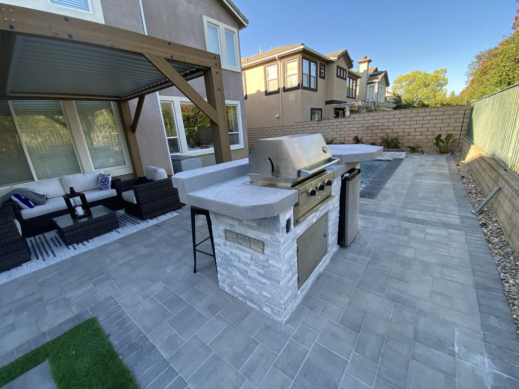 Pool deck with turf edge