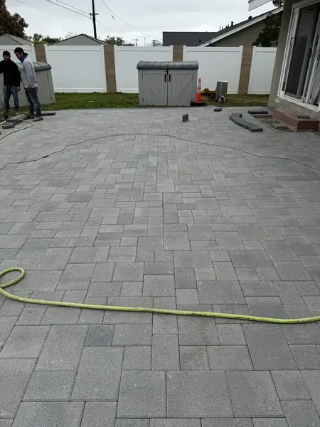 Grey paver driveway installation