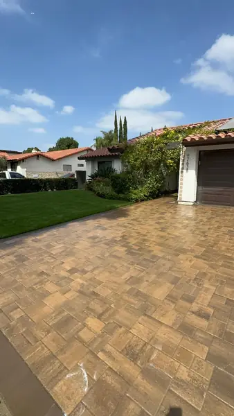 Finished driveway in tan interlocking pavers