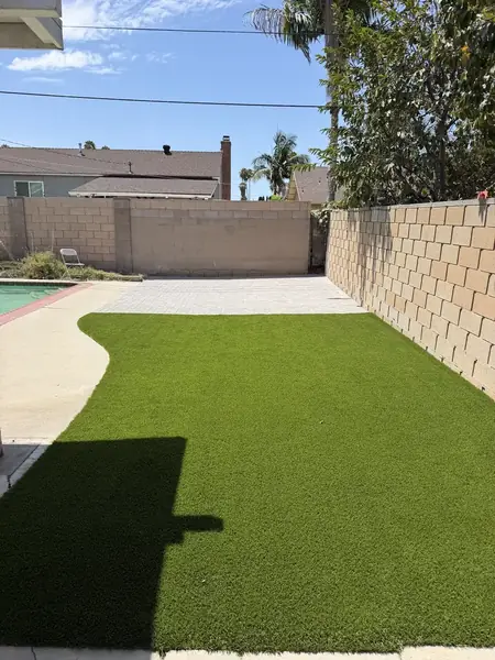 Turf lawn running alongside the house