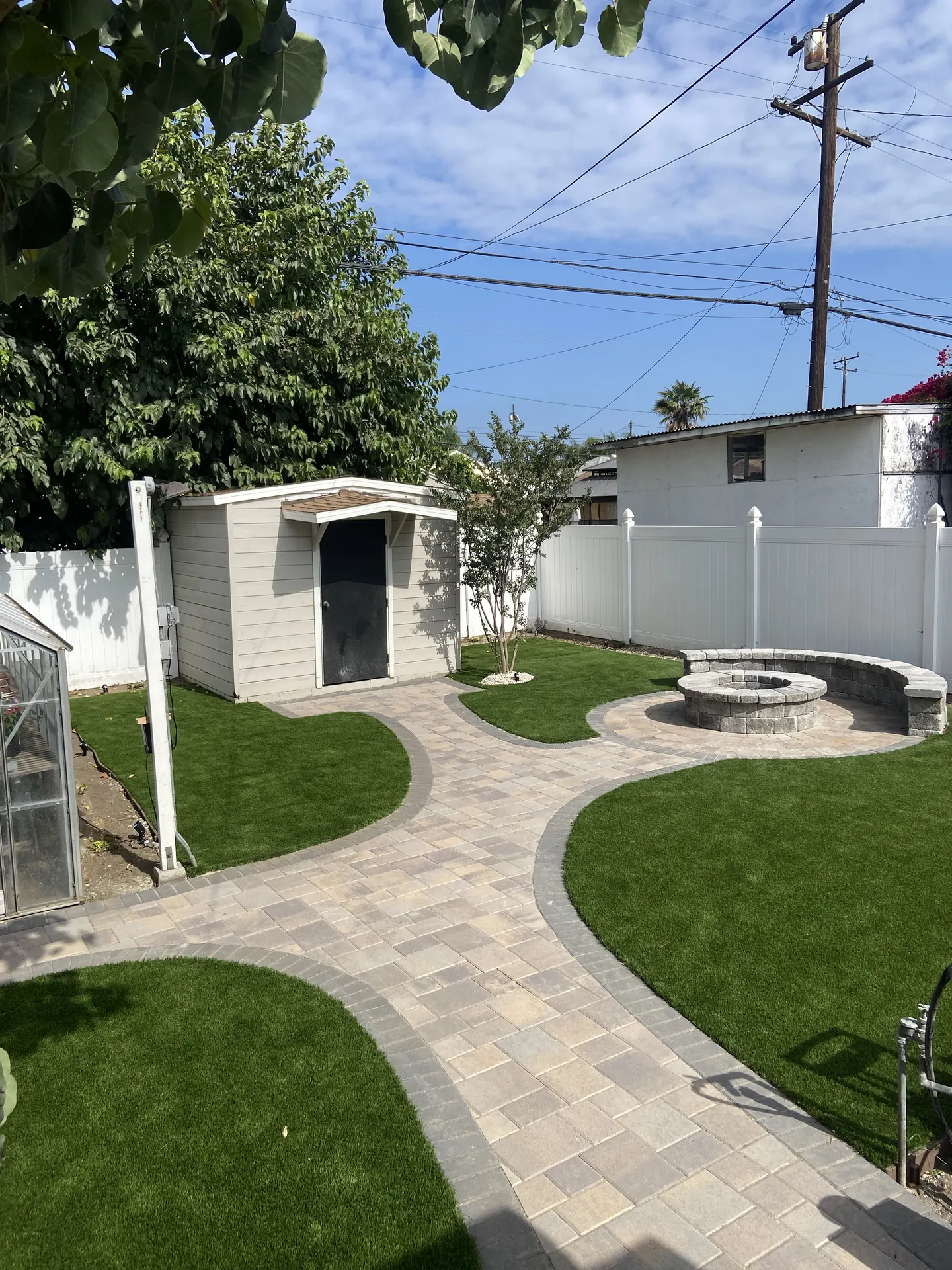 Turf and paver combination with a fire pit area