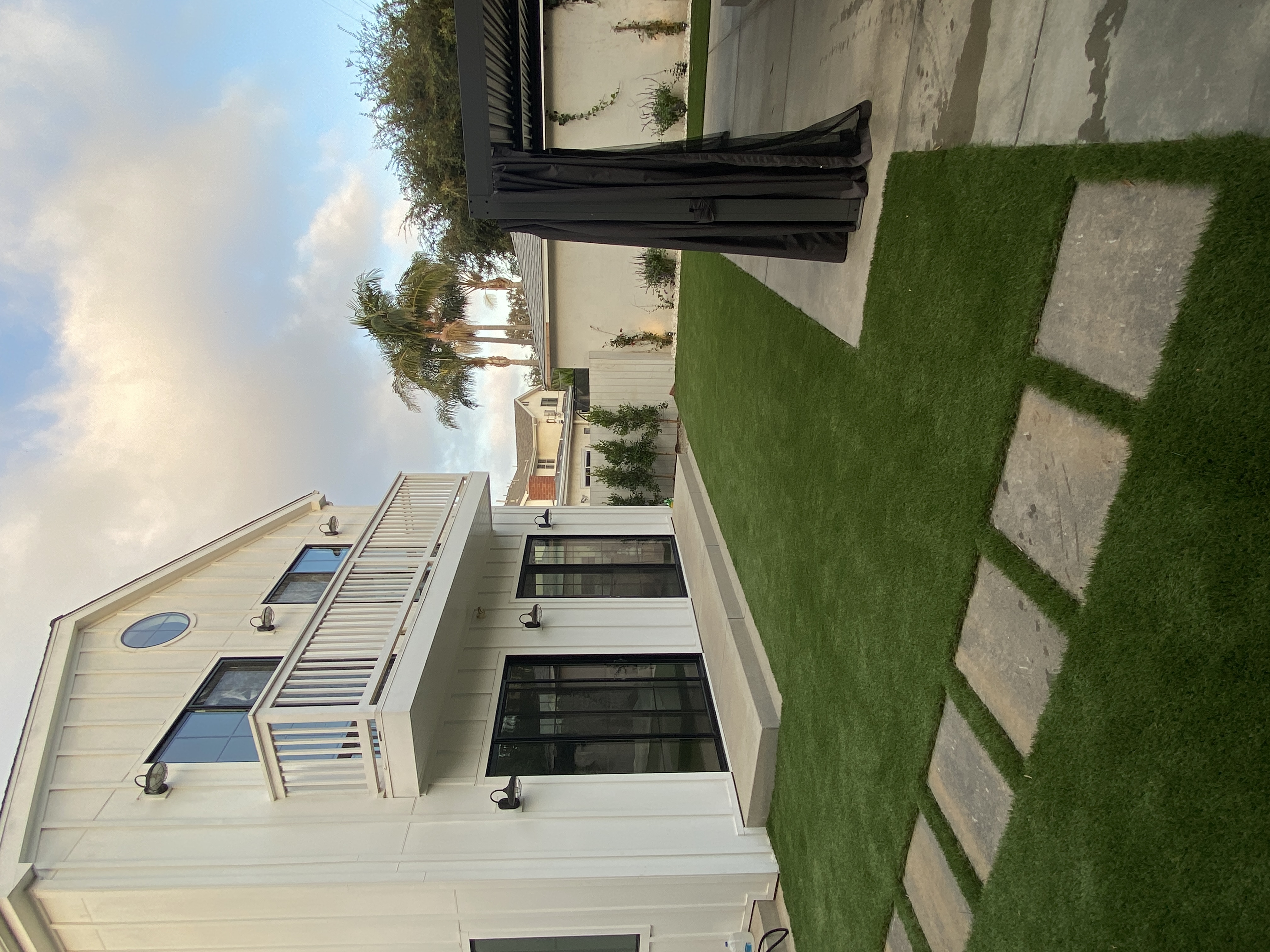 Backyard artificial turf with paver borders in LA