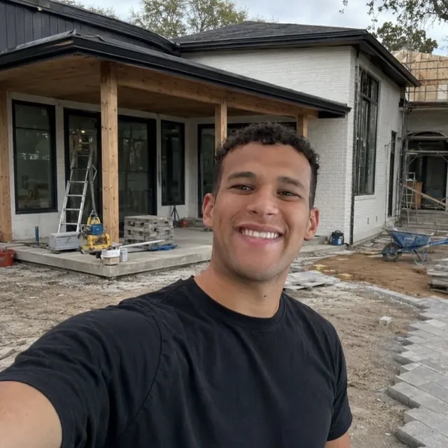 Eli Riskovich, founder of NexGen Remodeling, on a paver installation site